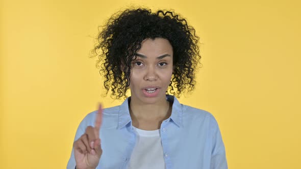 Portrait of Attractive Casual African Woman Saying No By Finger alt