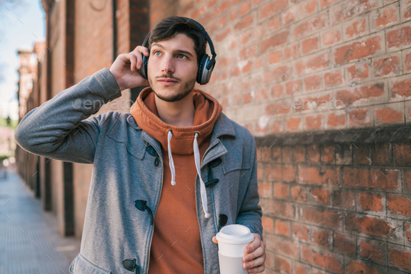 Young man listening to music.