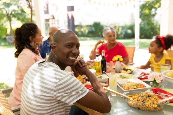 Man looking at camera and smiling - Stock Photo - Images