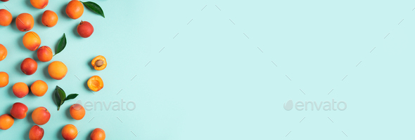 Apricot pattern on blue background. Top view, flat lay. Fresh summer fruit concept. Creative design - Stock Photo - Images