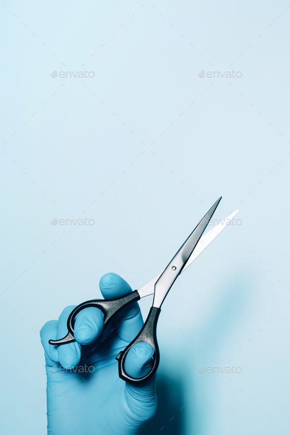Hairdresser\'s hands with scissors. New normal concept. Copy space. Stay safe. Health protection