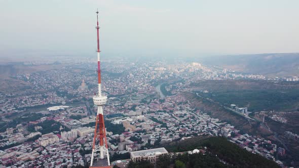 Transmit Mast On The Hill Over The City Aerial alt