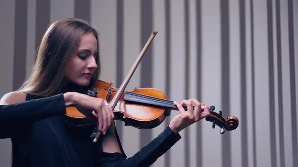 Girl Violin Playing at Studio, Woman Is Practicing Playing Musical Instrument