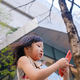Asian child using cell phone in city - PhotoDune Item for Sale