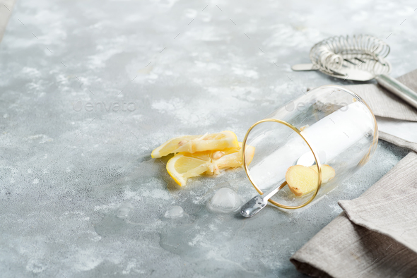 Refreshing ginger in a glass with drop water on a marble grey table - Stock Photo - Images