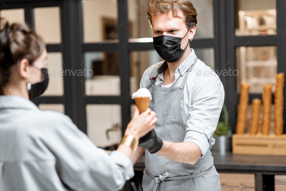 Salesman selling ice cream during pandemic time