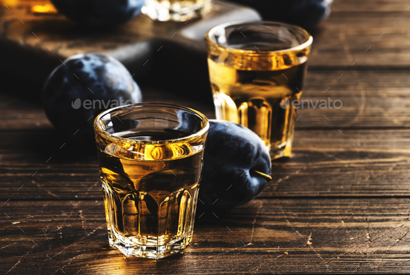 Slivovica - plum brandy or plum vodka, Balkan hard liquor, strong drink in shot glasses