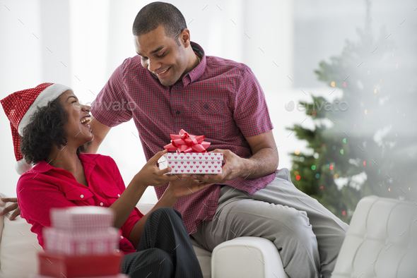 Christmas, woman wearing a red and white Father Christmas hat, - Stock Photo - Images