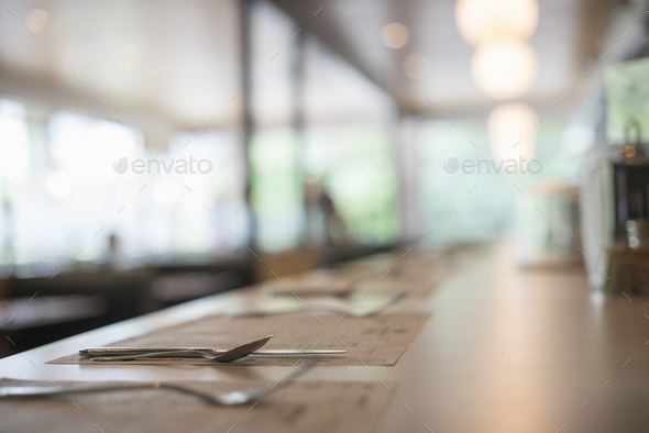 A empty table at a diner. Place settings. Surface view