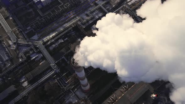 Industrial Emission carbon gases from factory pipes with smoke in atmosphere alt