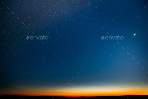 Night Starry Sky With Glowing Stars Above Countryside Field Landscape In Early Spring. Bright Glow - Stock Photo - Images