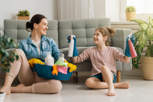 family cleaning the room - Stock Photo - Images