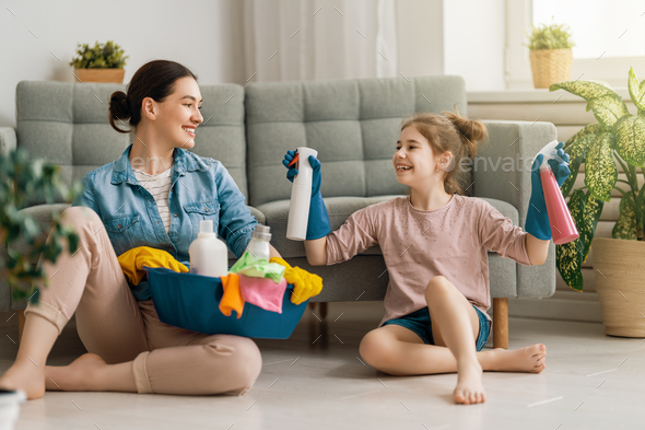 family cleaning the room