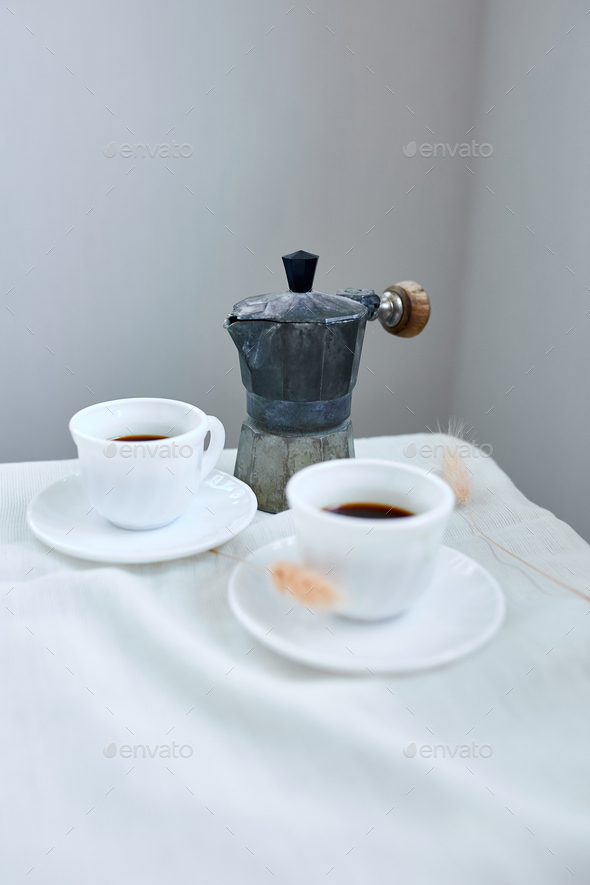 Cup and Coffee Pot with Coffee on White Table Stock Image - Image