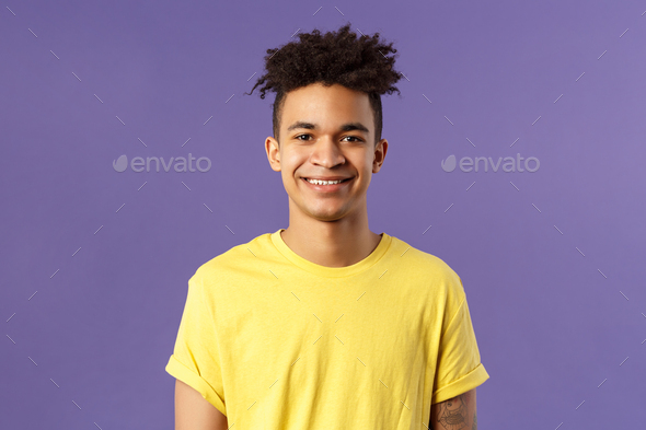 Close-up portrait of smiling, enthusiastic hispanic male student searching job, consider career