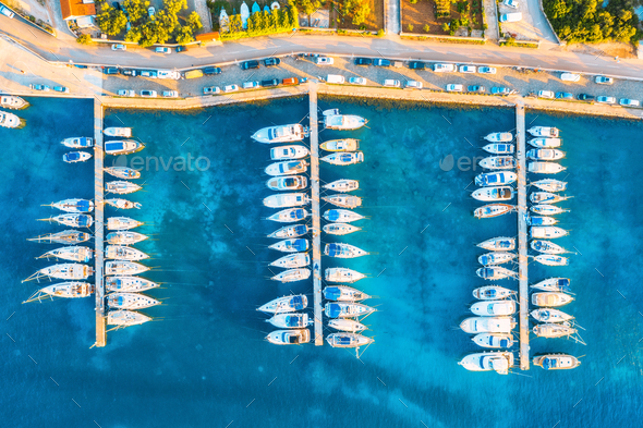 Aerial view of boats and yachts in port in old city at sunset - Stock Photo - Images