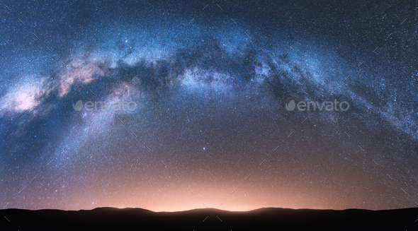 Landscape with bright arched milky way, sky with stars - Stock Photo - Images