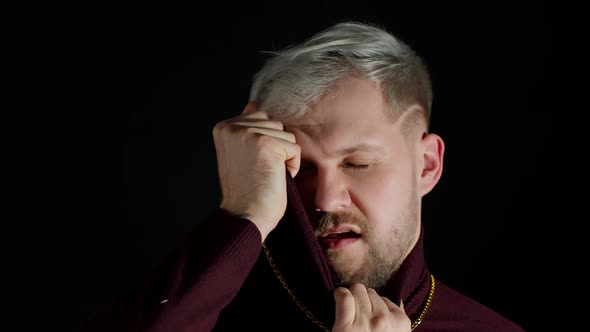 Stylish Man with Blue Eyes in Trendy Clothes Looking at Camera Feeling Happiness Fun Enjoyment alt
