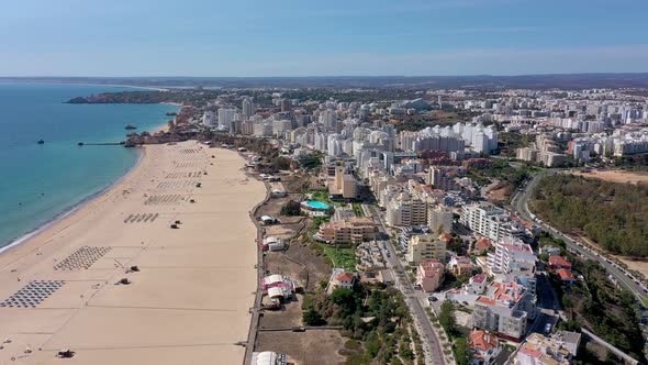 Beautiful Aerial Views of the Portuguese Southern City of Portimao Over the Stunning Beaches and alt