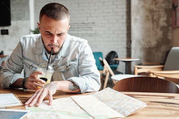 Finding best places to visit in cafe - Stock Photo - Images