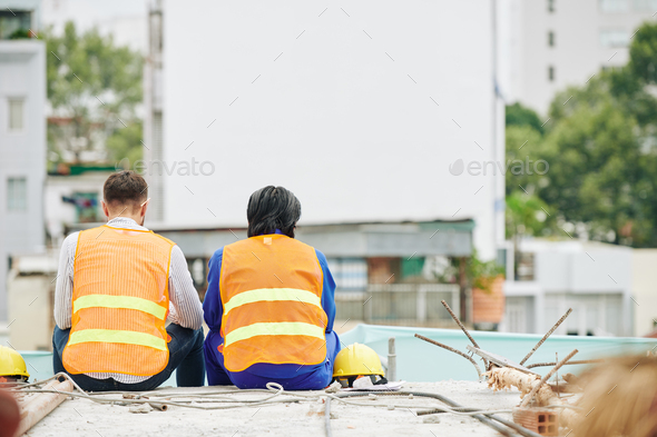 Construction workers resting after shift