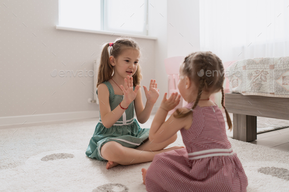 carefree cute girls playing lovely at home - Stock Photo - Images