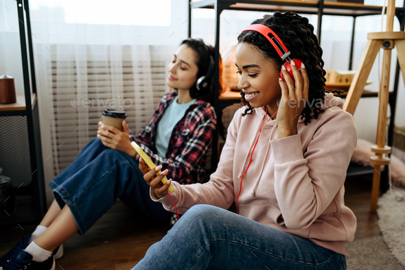 Women enjoys listening to music with coffe at home - Stock Photo - Images