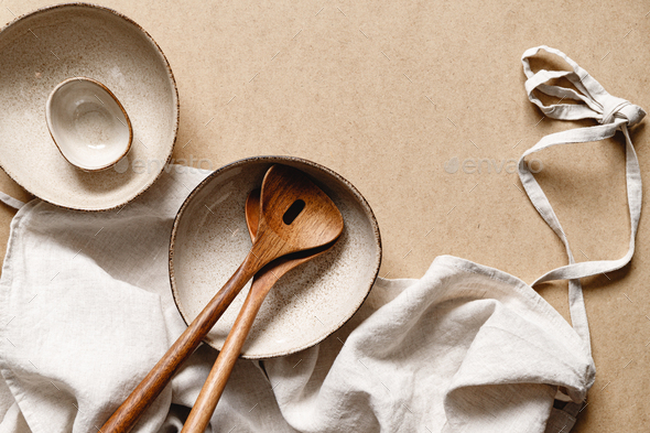 Modern minimalist ceramics set with a linen cloth over kraft paper background. - Stock Photo - Images