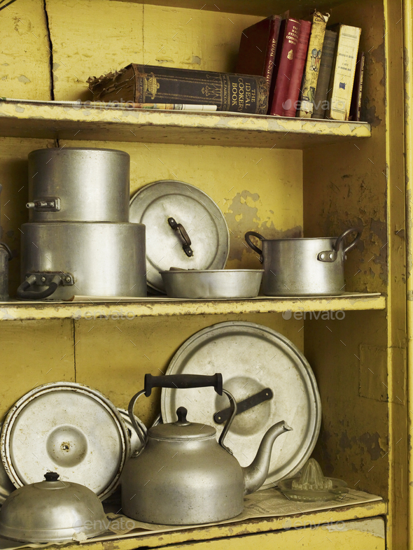 Old Well Worn Recipe Books And Pots And Pans On A Kitchen Shelf Stock Photo By Mint Images