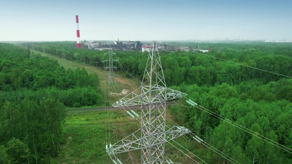 Highvoltage Power Transmission Lines Tower on a Dirty Coalfired Carbon Dioxideemitting Factory