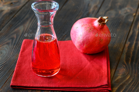 Glass jug of grenadine syrup