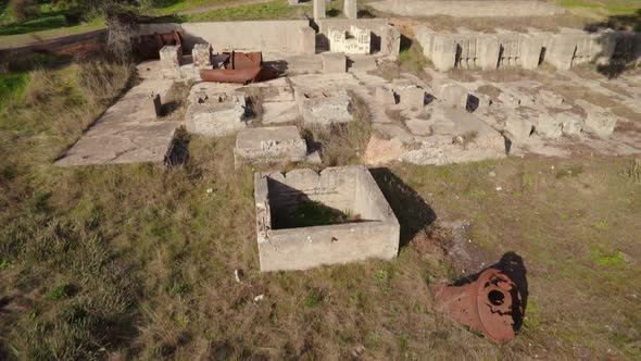 Sweeping drone shot of Victoria Hill Mining Reserve in Bendigo looking up to the poppet head on the alt