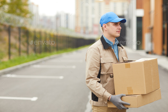 Courier delivering parcels Stock Photo by AnnaStills | PhotoDune