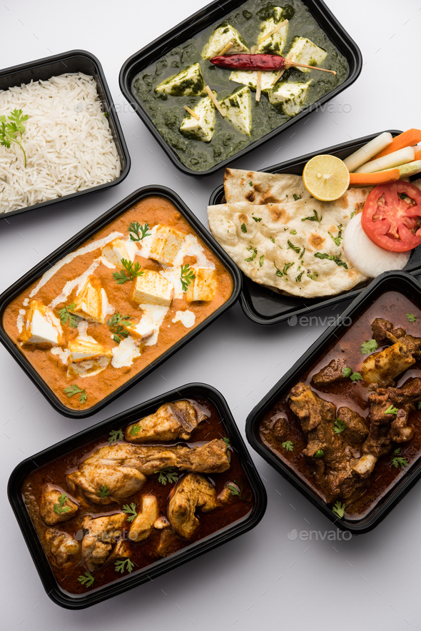 Online food delivery concept for Indian Restaurant showing plastic containers with food