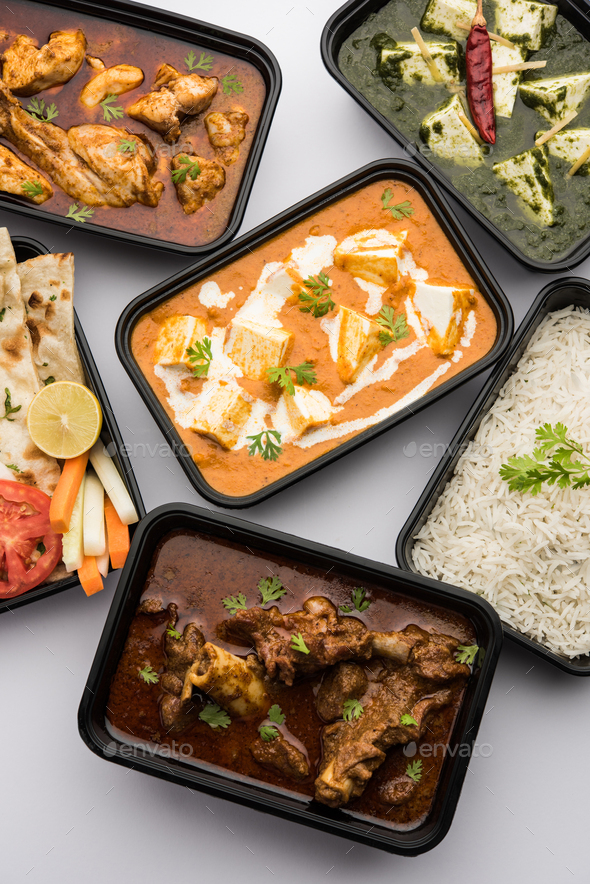 Online food delivery concept for Indian Restaurant showing plastic containers with food