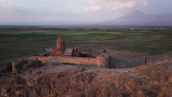 Khor Virab monastery and Mount Ararat at sunrise. Armenia. 4K Aerial alt