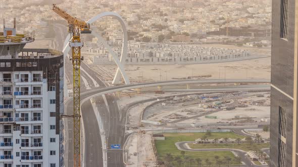 Skyscrapers and Road with Bridge Before Sunset Timelapse of Doha Qatar alt