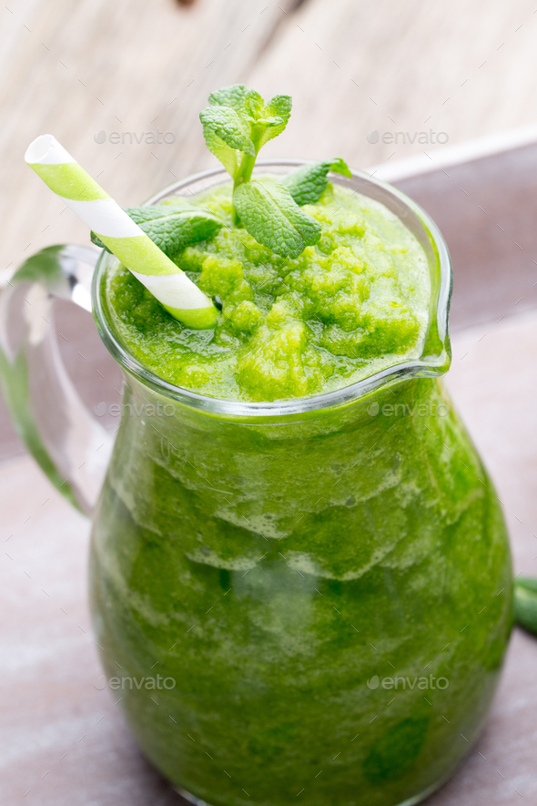 Rucola smoothie, on the grey background. Stock Photo by GitaKulinica