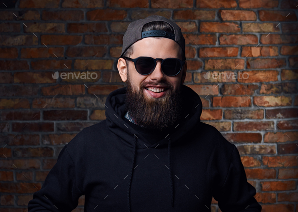 Tattooed bearded male in military jacket. - Stock Photo - Images