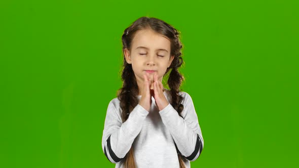 Baby Crosses His Fingers in His Arms. Green Screen alt