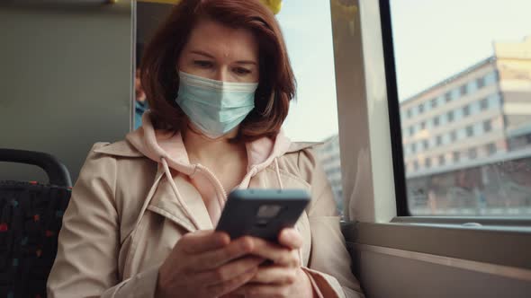 Female Commuter Browsing Internet While Sitting in Bus alt
