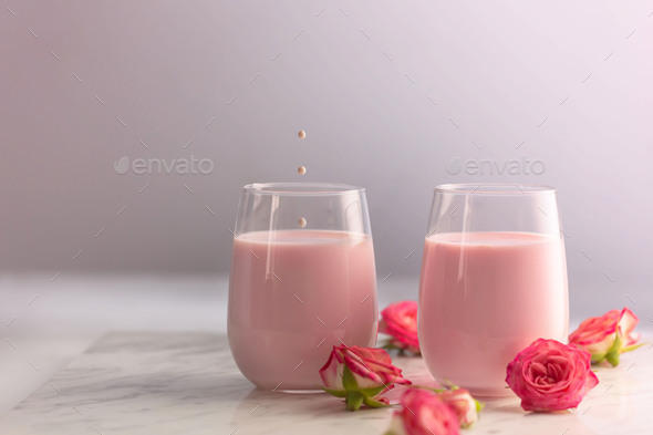 Moon milk prepares with pink rose flower. Trendy relaxing bedtime drink form Ayurvedic traditions