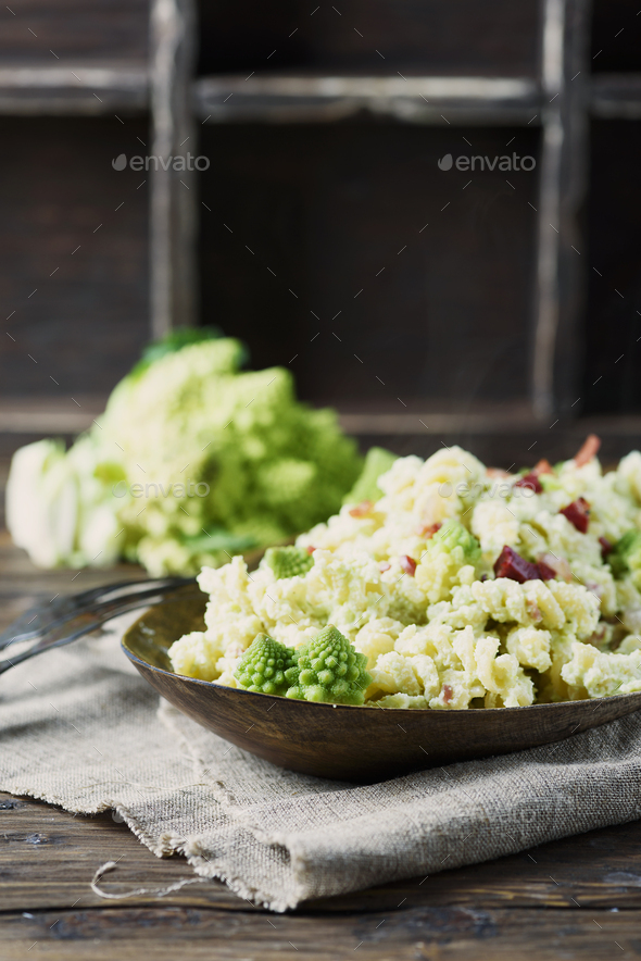 Pasta with Roman cauliflower, ricotta and ham Stock Photo by