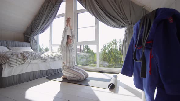 Woman Doing Yoga in Morning alt