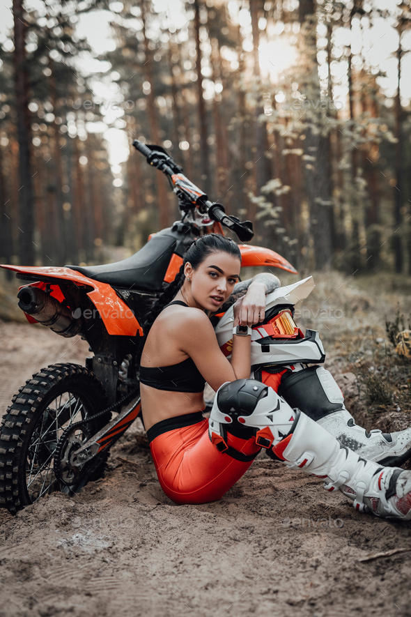 Tattooed Female Racer Wearing Motocross Outfit With Semi Naked Torso Stock Photo By Fxquadro