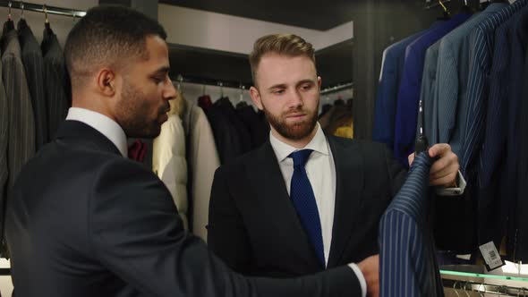 In the Modern Suit Shop Businessman Try to Choose