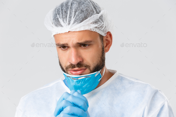 Covid-19 pandemic, virus outbreak, clinic and healthcare workers concept. Close-up shot of desperate - Stock Photo - Images