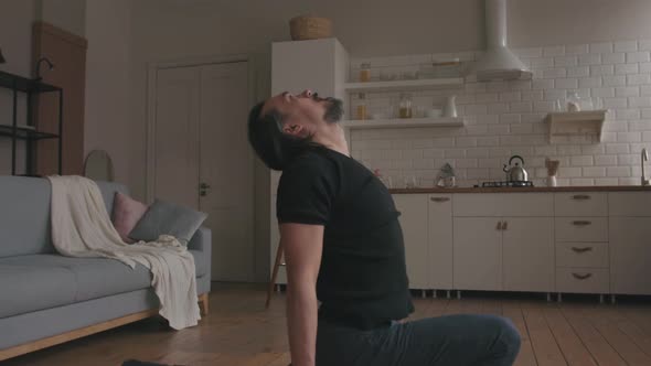 Man Practicing Yoga at home