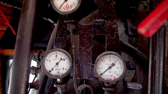  Dolly Video of Lots of Pipes, Valves and Gauges in Old Steam Locomotive Train Cabin. alt