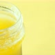 Close Pu of Homemade Ghee in Container on Yellow Background - VideoHive Item for Sale